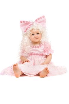 Baby girl in a pink dress. Isolated