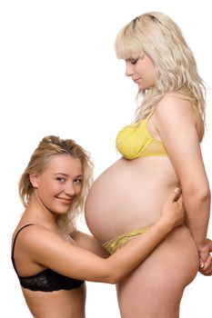 Cheerful young woman and a pregnant girlfriend