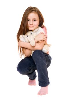 Beautiful little girl with a teddy elephant. Isolated