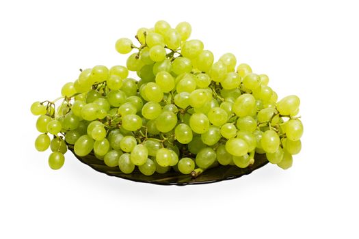 dish with green grapes on a white background