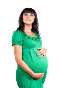Portrait of a pregnant girl in green dress
