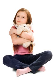 Pretty little girl with a teddy elephant