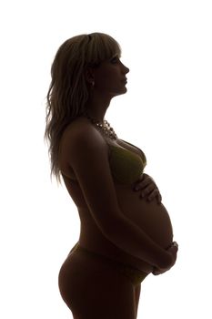 Silhouette of a pregnant girl. Isolated on white