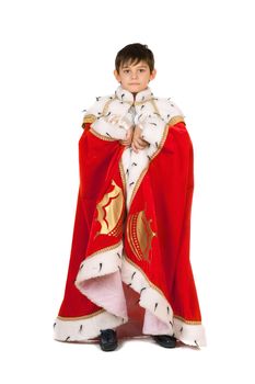 Boy dressed in a robe of King. Isolated on white