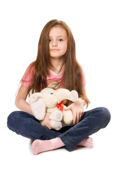 Beautiful little girl with a teddy elephant