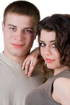 Portrait of the beautiful young couple. Isolated on white