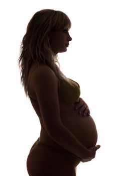 Silhouette of a pregnant young woman. Isolated