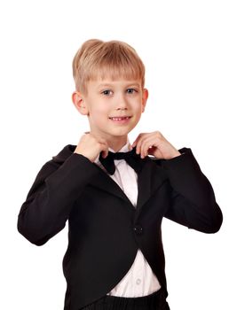 boy with bow tie and black tuxedo suit