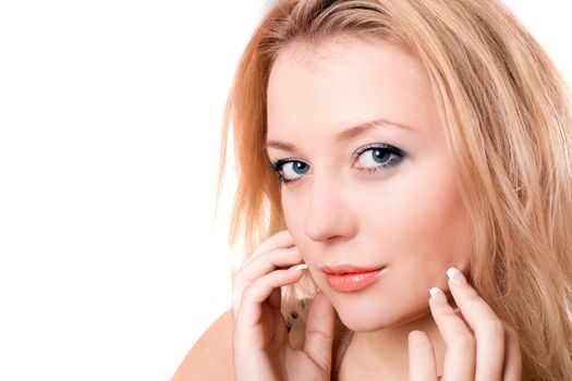 Closeup portrait of a lovely young blonde. Isolated