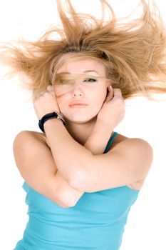 Portrait of sexy blond girl lying on a white