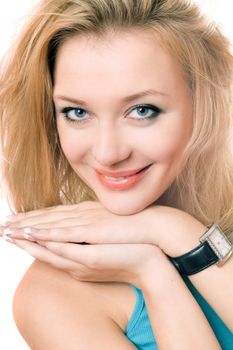 Closeup portrait of a smiling young blonde. Isolated on white