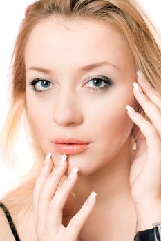 Closeup portrait of a playful beautiful blonde. Isolated