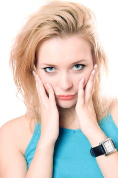 Closeup portrait of a playful attractive blonde. Isolated on white
