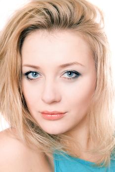 Closeup portrait of a attractive blonde. Isolated on white