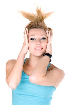 Portrait of smiling young blond girl lying on a white