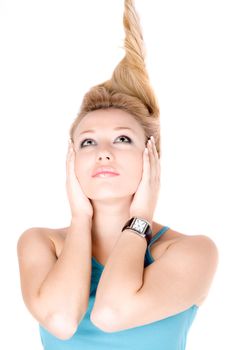 Portrait of pretty young blond girl lying on a white