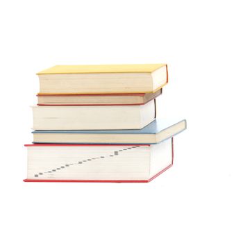 Pile of books or textbooks stacked with their spines facing away from the camera isolated on a white studio background