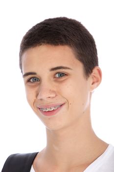 Head portrait of an attractive smiling teenage boy with orthodontic braces on his teeth to correct dental alignment isolated on white