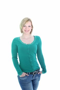 Three quarter studio portrait of a sexy curvy young blonde woman in jeans posing with her hands in her pockets isolated on white