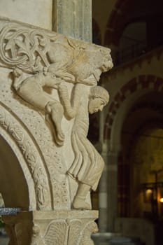 Ancient sculpture inside Basilica of Sant'Ambrogio, in Milan, Italy