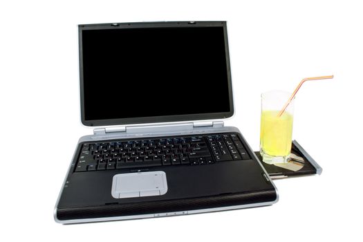 The laptop and cocktail. Isolated on white background