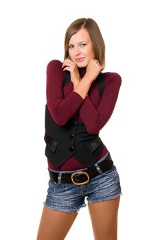 Portrait of smiling girl in a black vest and denim shorts