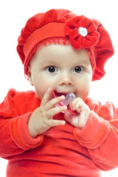 Portrait of cute baby girl with dummy. Isolated