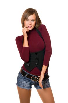 Portrait of playful girl in a black vest and denim shorts