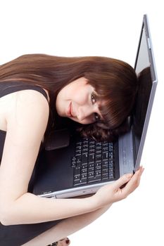 The young businesswoman lies on the laptop. Isolated