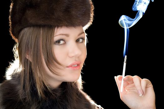 Portrait of the beautiful woman with a cigarette