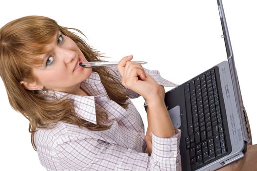 The young woman sits with the laptop. Isolated