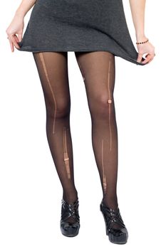 Female legs in the torn stockings. Isolated on white
