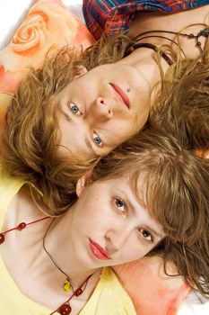 Portrait of the young beautiful couple laying on a pillow