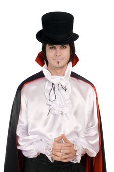 Smiling young man in a suit of Count Dracula
