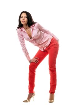 Playful young brunette in red jeans. Isolated
