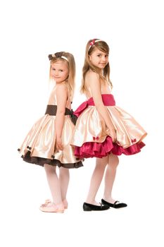 Two nice little girls in a dress. Isolated