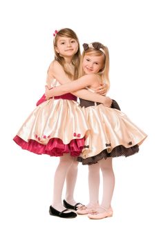 Two happy little girls in a dress. Isolated
