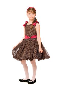 Attractive little lady in a brown dress. Isolated