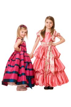 Two cute little girls in a long dress