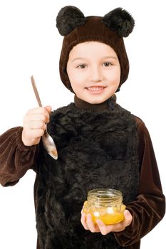 Boy dressed as bear with a jar of honey