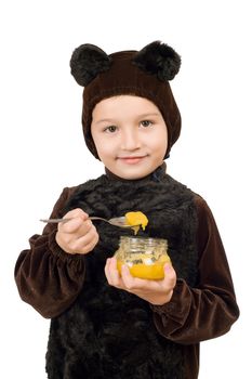 Boy dressed as bear with a jar of honey. Isolated