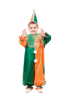 Boy dressed as harlequin. Isolated on white