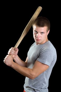 Aggressive young man with a bat. Isolated
