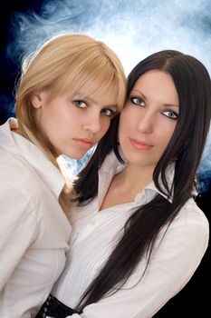 Portrait of the young pretty brunette and blonde