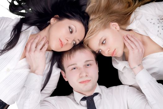 Portrait if the young man and two pretty women