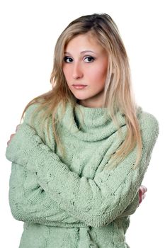 Young beautiful caucasian woman in warm sweater. Isolated