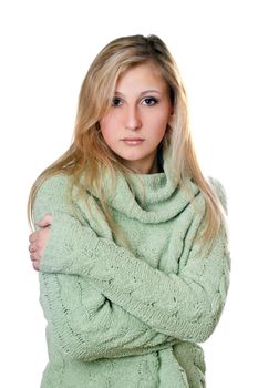 Young beautiful woman in warm sweater. Isolated on white