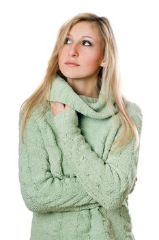 Young beautiful woman posing in sweater. Isolated on white