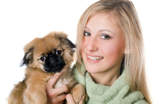 Portrait of cheerful woman with a pekinese puppy. Isolated