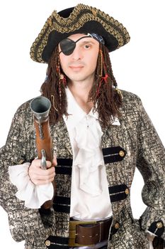 Portrait of man dressed as pirate with a pistol in hand. Isolated
